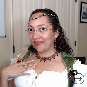 Camille Diaz with a chainmail headpiece and necklace.