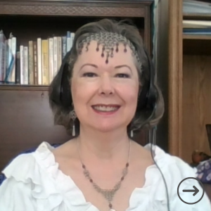 Linda-Ann Stewart with a chainmail headpiece and necklace.